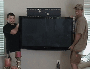John and Daniel installing a TV